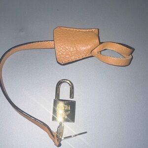 MCM lock and key with Tan Leather Strap and key Keeper